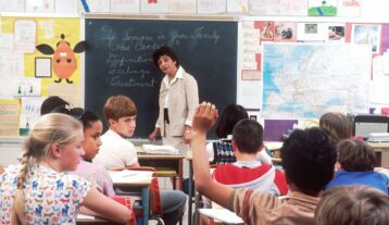 woman standing in front of children