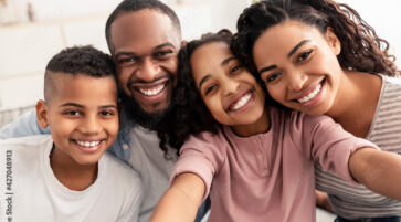 Portrait of african american family taking a selfie together at home